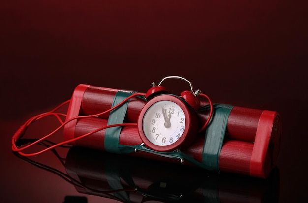 Red background with a timebomb made of dynamite sticks and a countdown timer